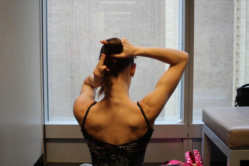 Further twisting the ponytail for a neat french twist