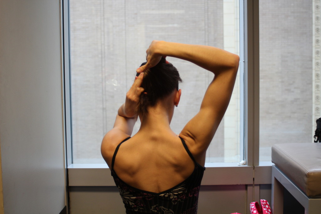 Rolling the twist towards the head for a refined look
