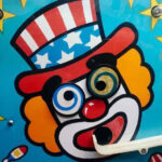 Tommy the Clown performing at an event, showcasing his unique style of dance and entertainment