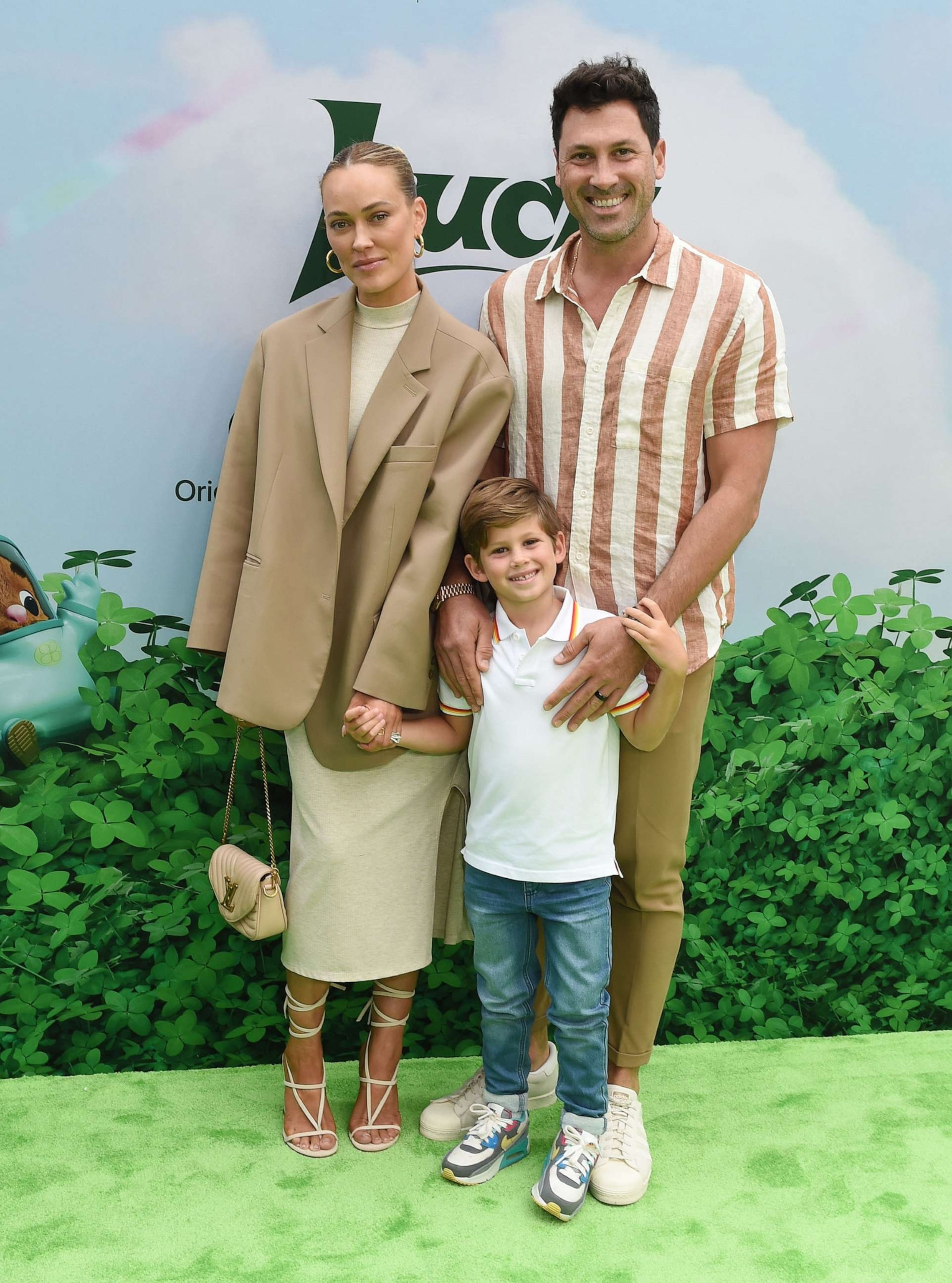 Peta Murgatroyd, Maksim Chmerkovskiy, and their son Shai Aleksander Chmerkovskiy, highlighting the importance of family and shared experiences.
