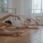 Ballet dancers in elegant poses, showcasing grace and precision