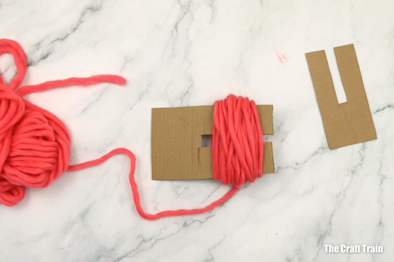 Shaping the pom poms into body parts