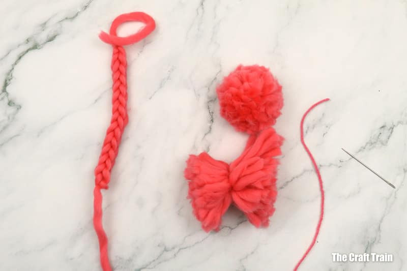 Attaching the marionette strings to the flamingo
