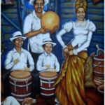 Bomba drums and musicians playing at an outdoor festival, showcasing cultural pride.
